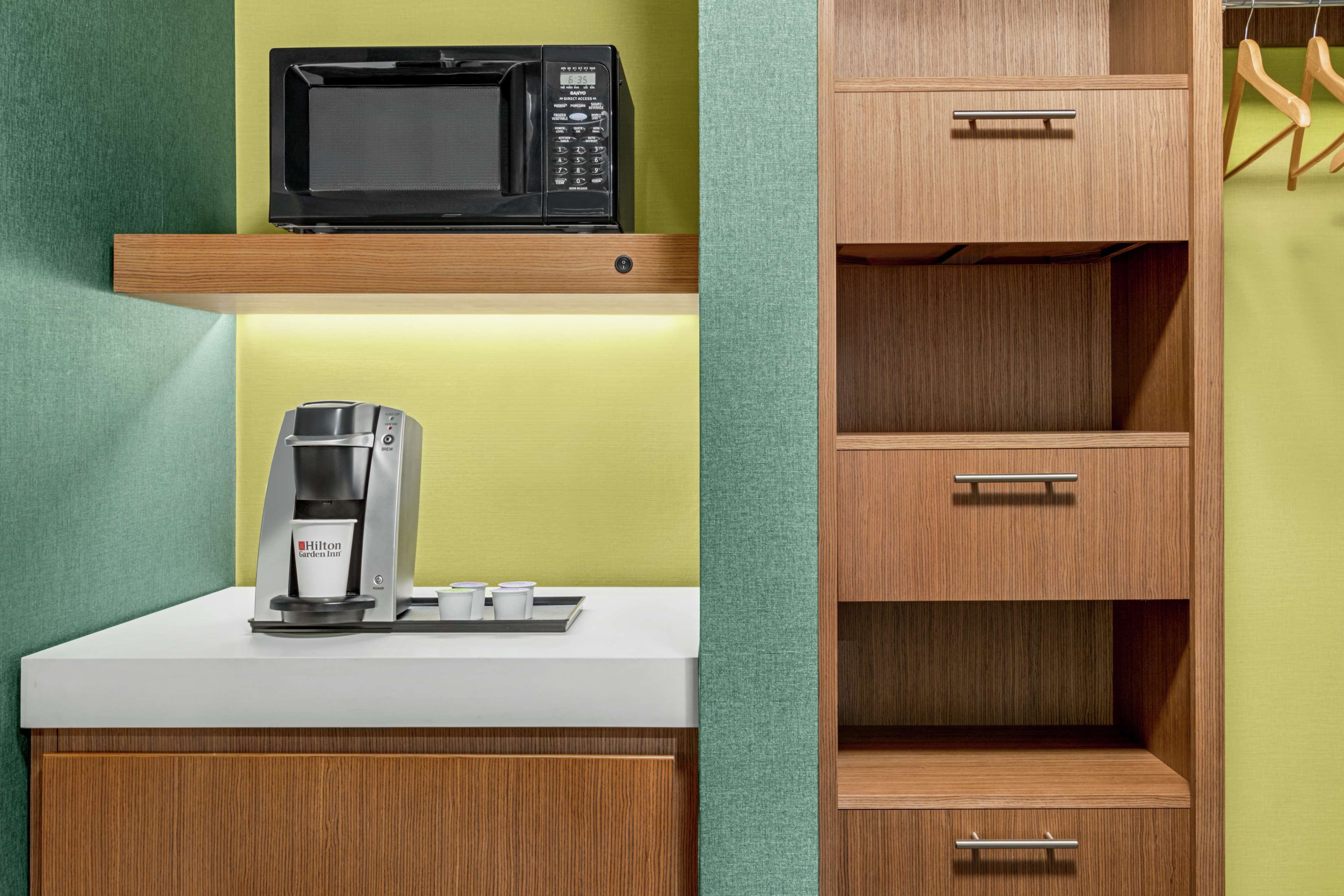 hypo-allergenic bedding, desk, laptop workspace, blackout curtains