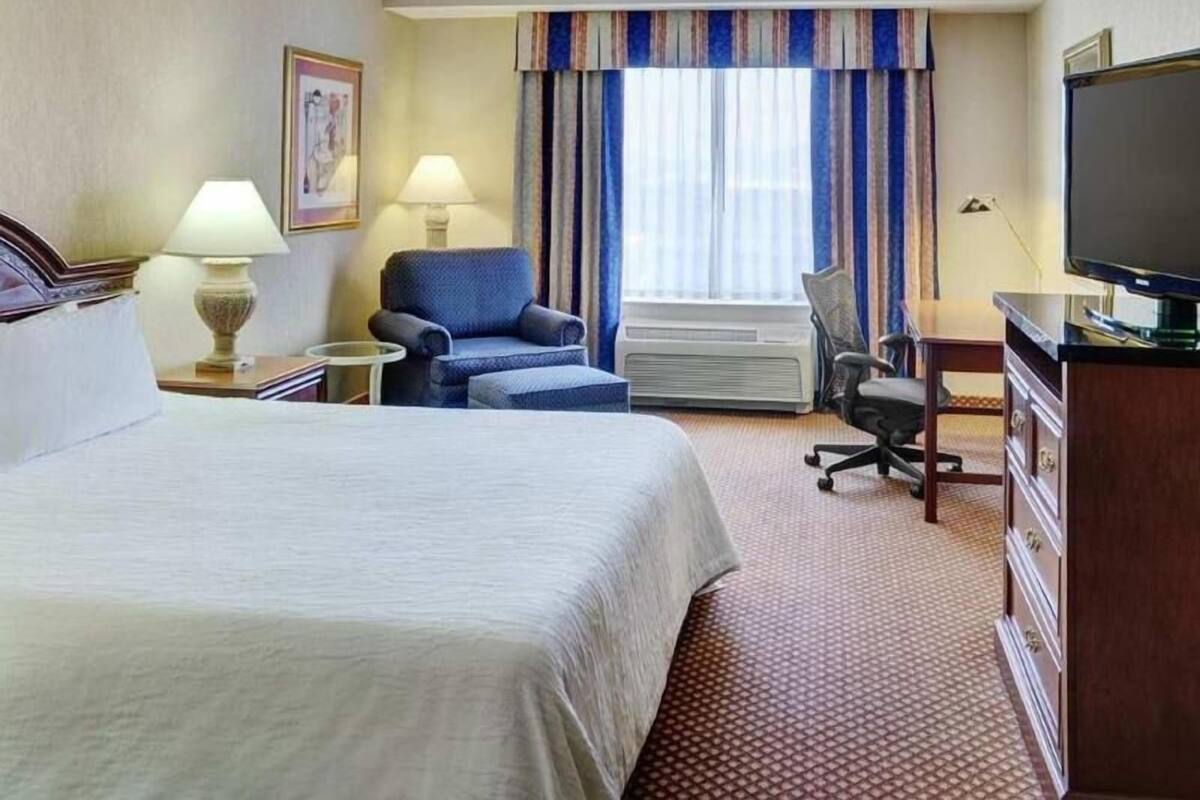 Hypo-allergenic bedding, desk, laptop workspace, blackout curtains