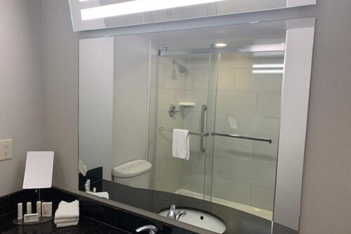 designer toiletries, hair dryer, towels, soap