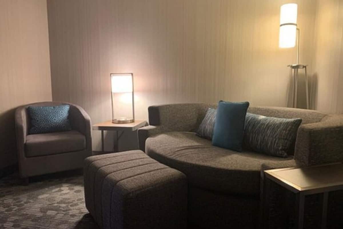 suite, 1 bedroom, non smoking | living area | 55-inch lcd tv with satellite channels, tv, ipod dock