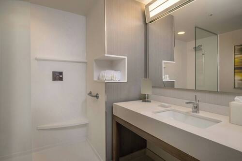 Designer toiletries, hair dryer, towels, soap