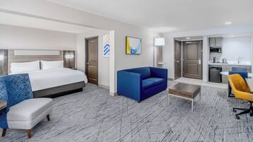 Suite, 1 King Bed (Extra Floor Space) | Desk, laptop workspace, blackout drapes, iron/ironing board