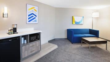 Suite, 1 King Bed (Extra Floor Space) | Desk, laptop workspace, blackout drapes, iron/ironing board