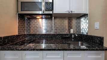 Two Queen Studio Suite | Private kitchenette | Coffee/tea maker