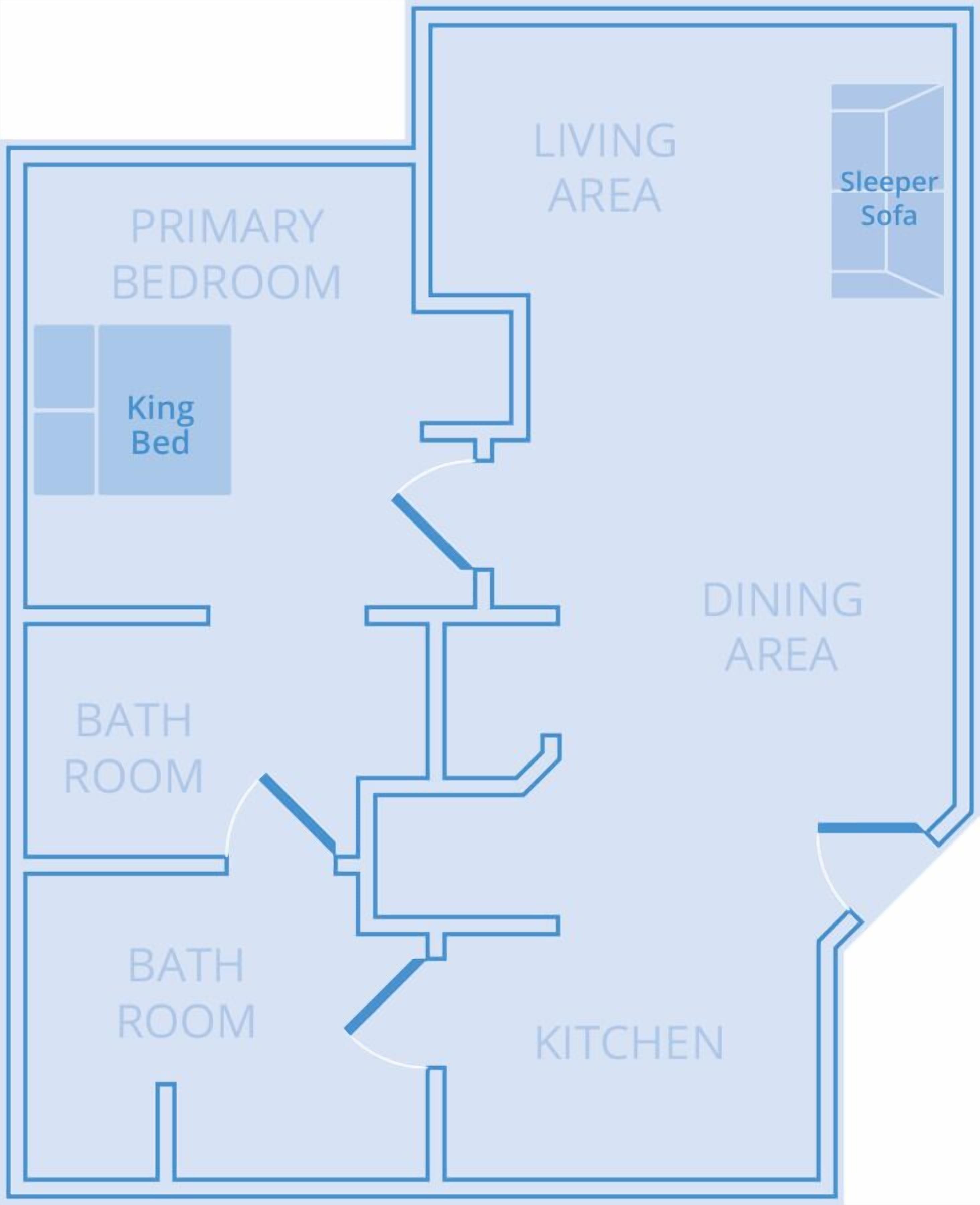 A floor plan with a primary bedroom, king bed, two bathrooms, a kitchen, a dining area, and a living area with a sleeper sofa.