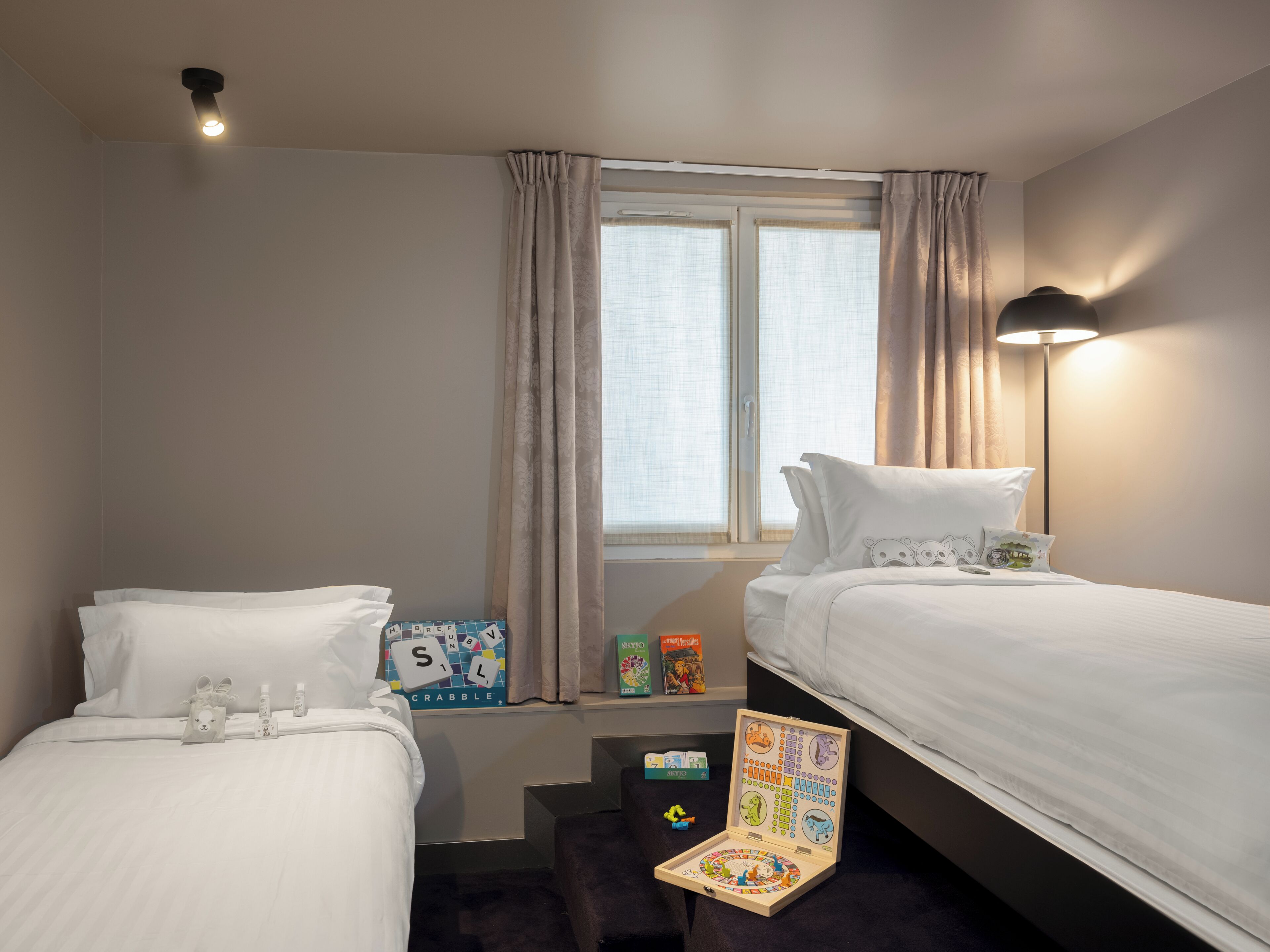 Deluxe Quadruple Room | In-room safe, desk, laptop workspace, blackout drapes