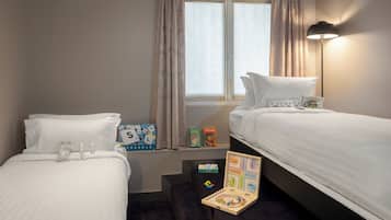 Deluxe Quadruple Room | In-room safe, desk, laptop workspace, blackout drapes