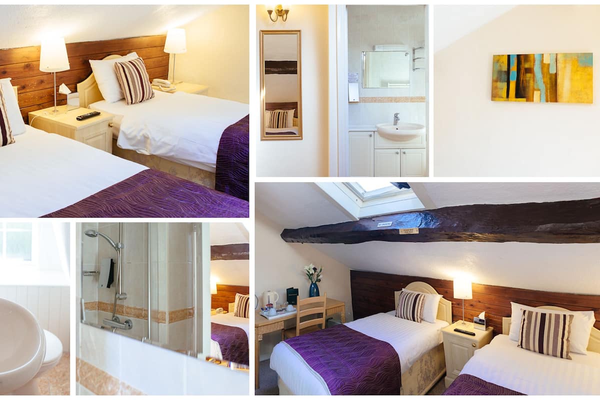 Chambre avec lits jumeaux, salle de bains attenante | 1 chambre, rideaux occultants, Wi-Fi gratuit, draps fournis