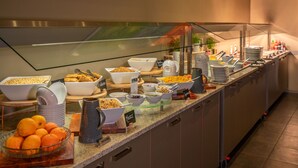 A buffet with various food items and utensils. - Scenic Hotel Dunedin City (Dunedin)