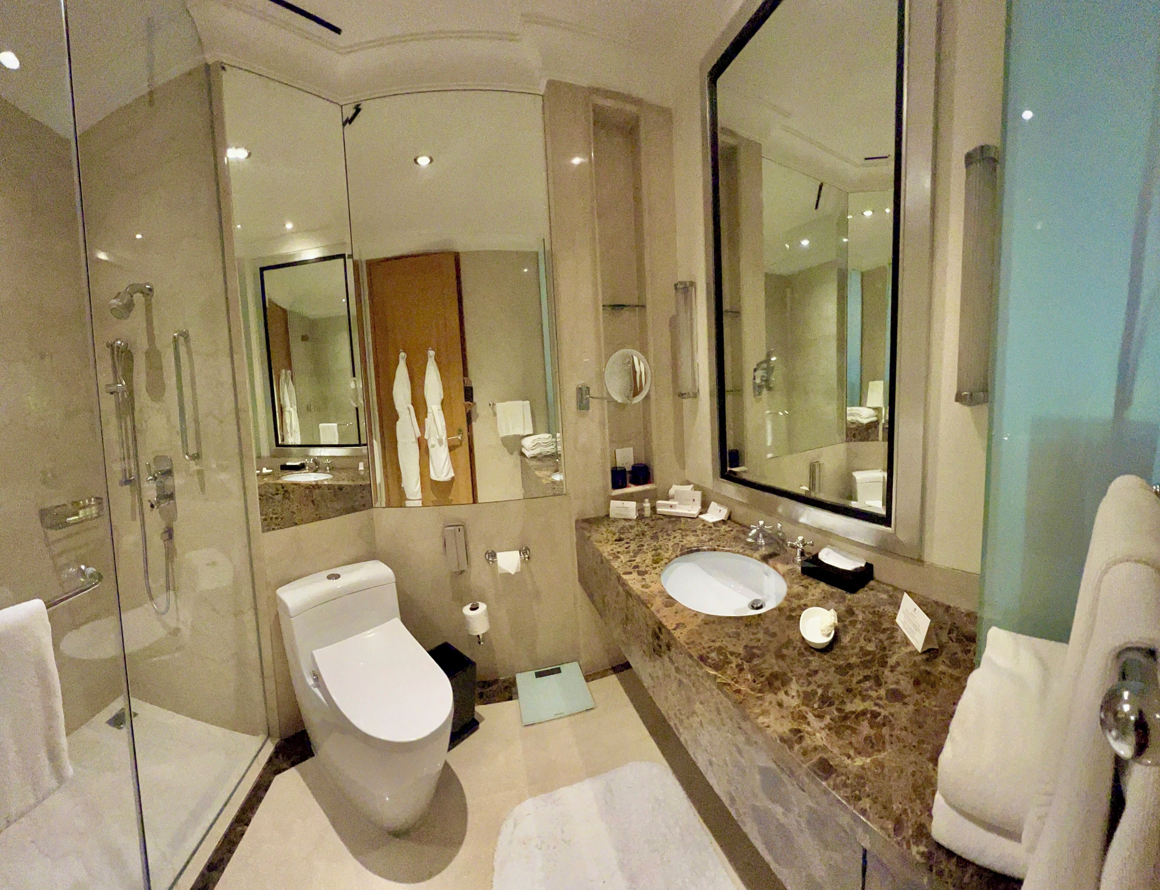 designer toiletries, hair dryer, bathrobes, slippers