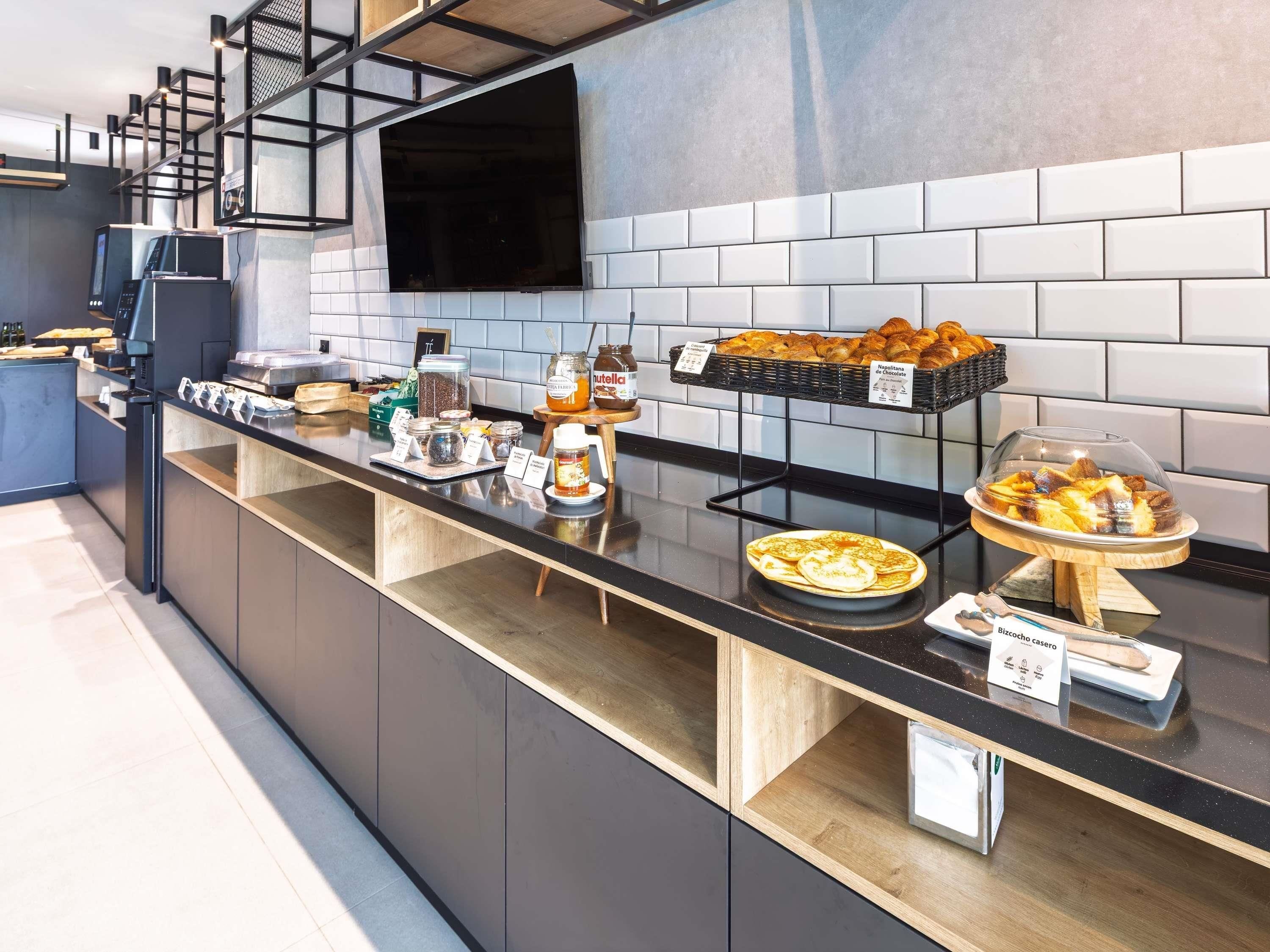 A breakfast buffet with various food items and condiments.