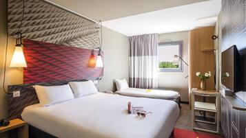 Chambre triple avec 1 lit double et 1 lit d'appoint