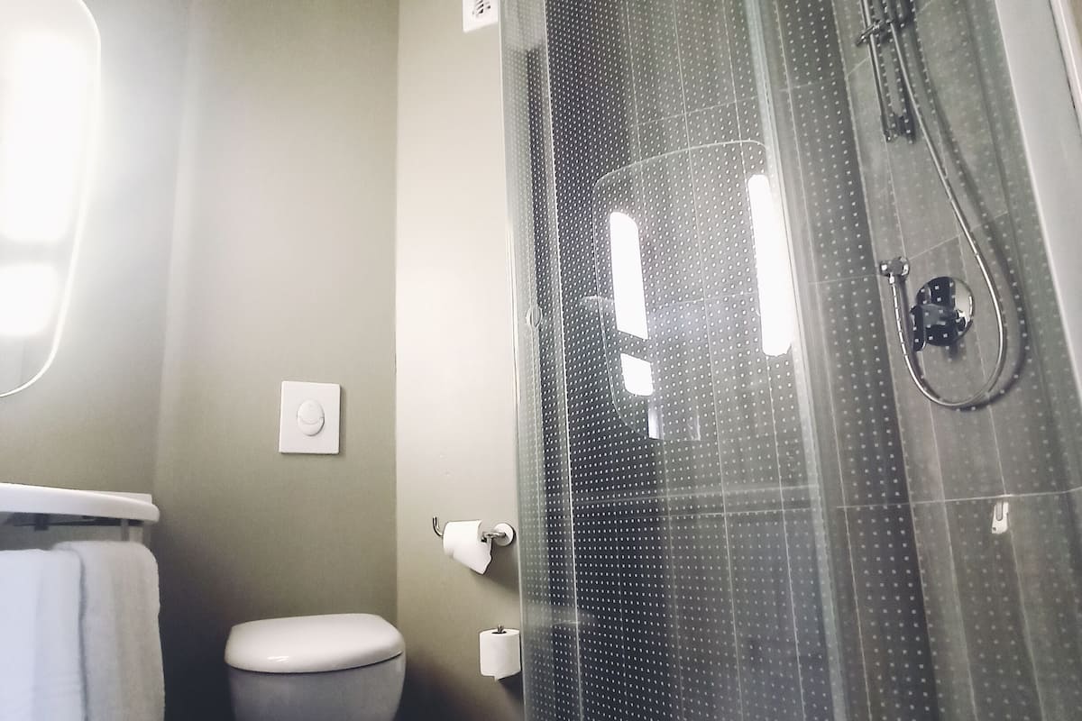 shower, eco-friendly toiletries, hair dryer, towels