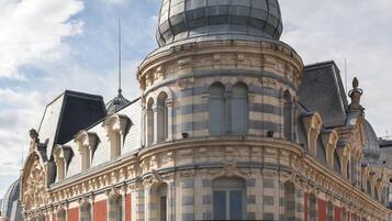 A historic building with a prominent dome and ornate architectural details.