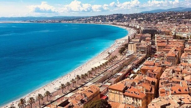 A coastal cityscape with a beach, buildings, and a clear sky. - Le Riviera Collection, BW Signature Collection (Nice)