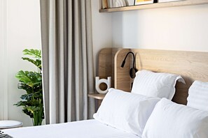 Premium bedding, pillow-top beds, minibar, in-room safe