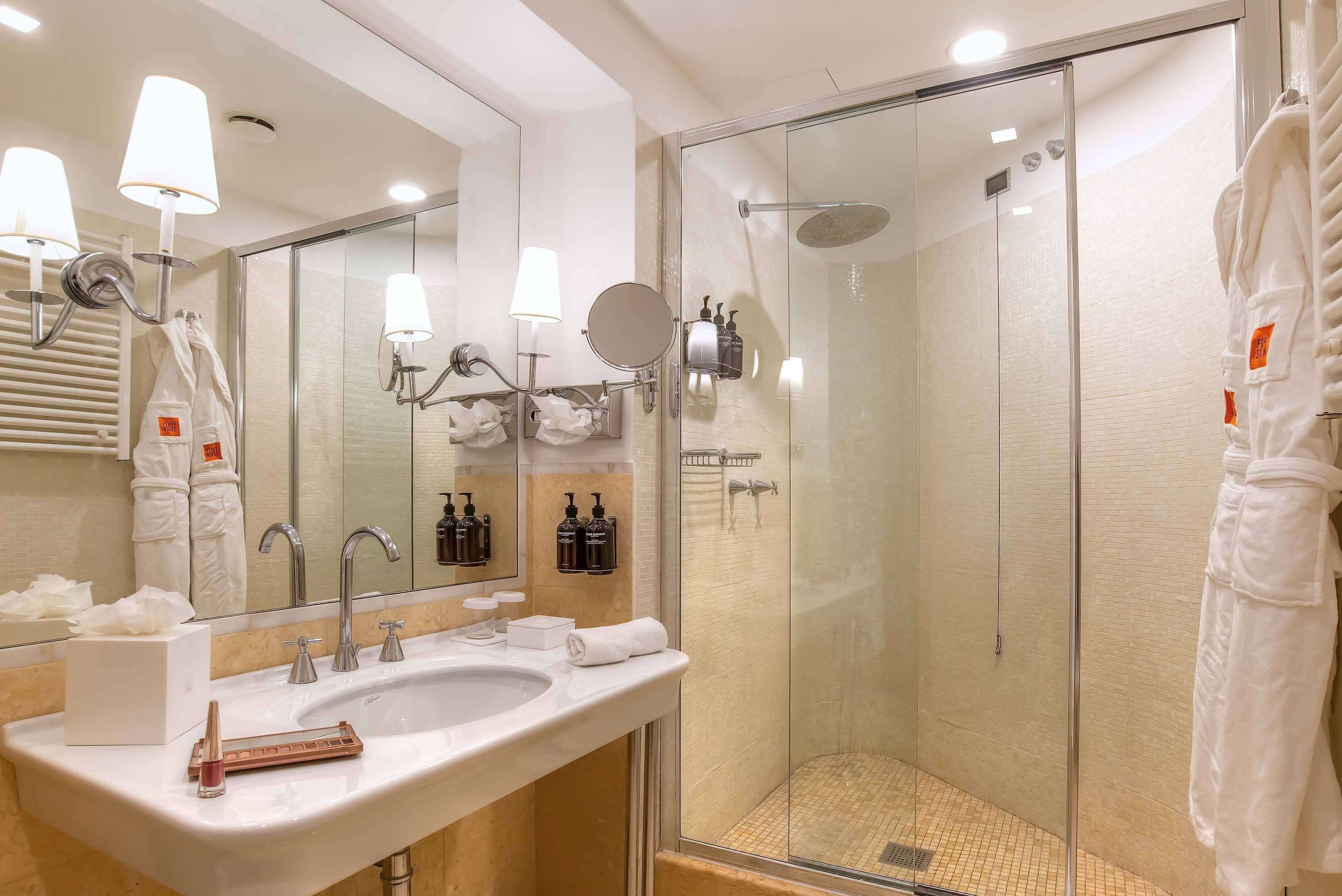 executive double room | bathroom | designer toiletries, hair dryer, bathrobes, slippers