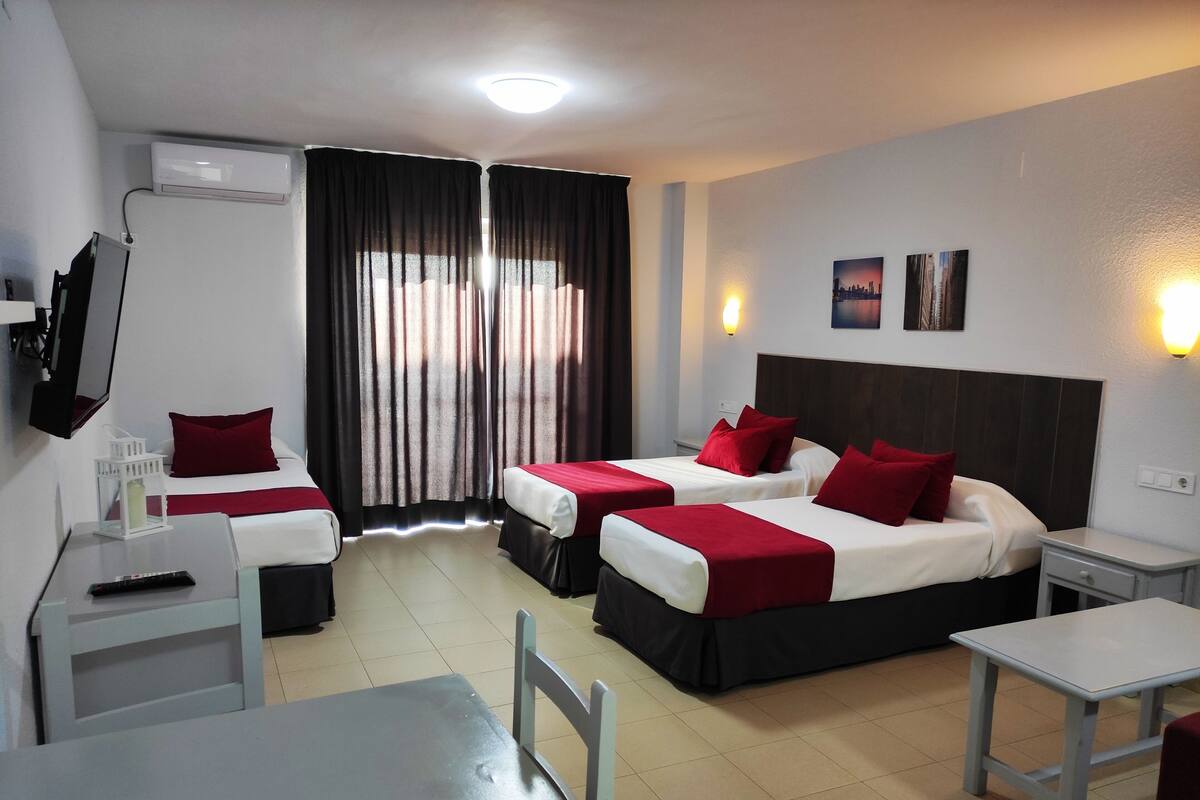 Desk, laptop workspace, free WiFi, bed sheets