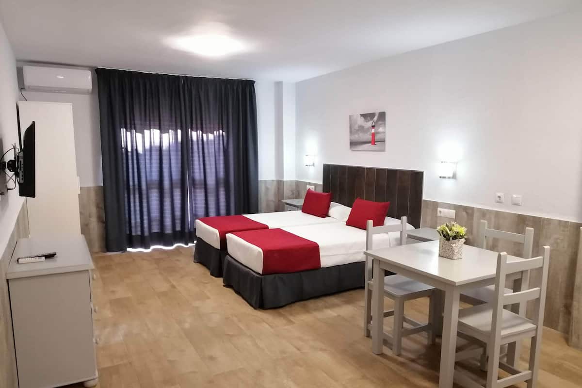 Desk, laptop workspace, free WiFi, bed sheets