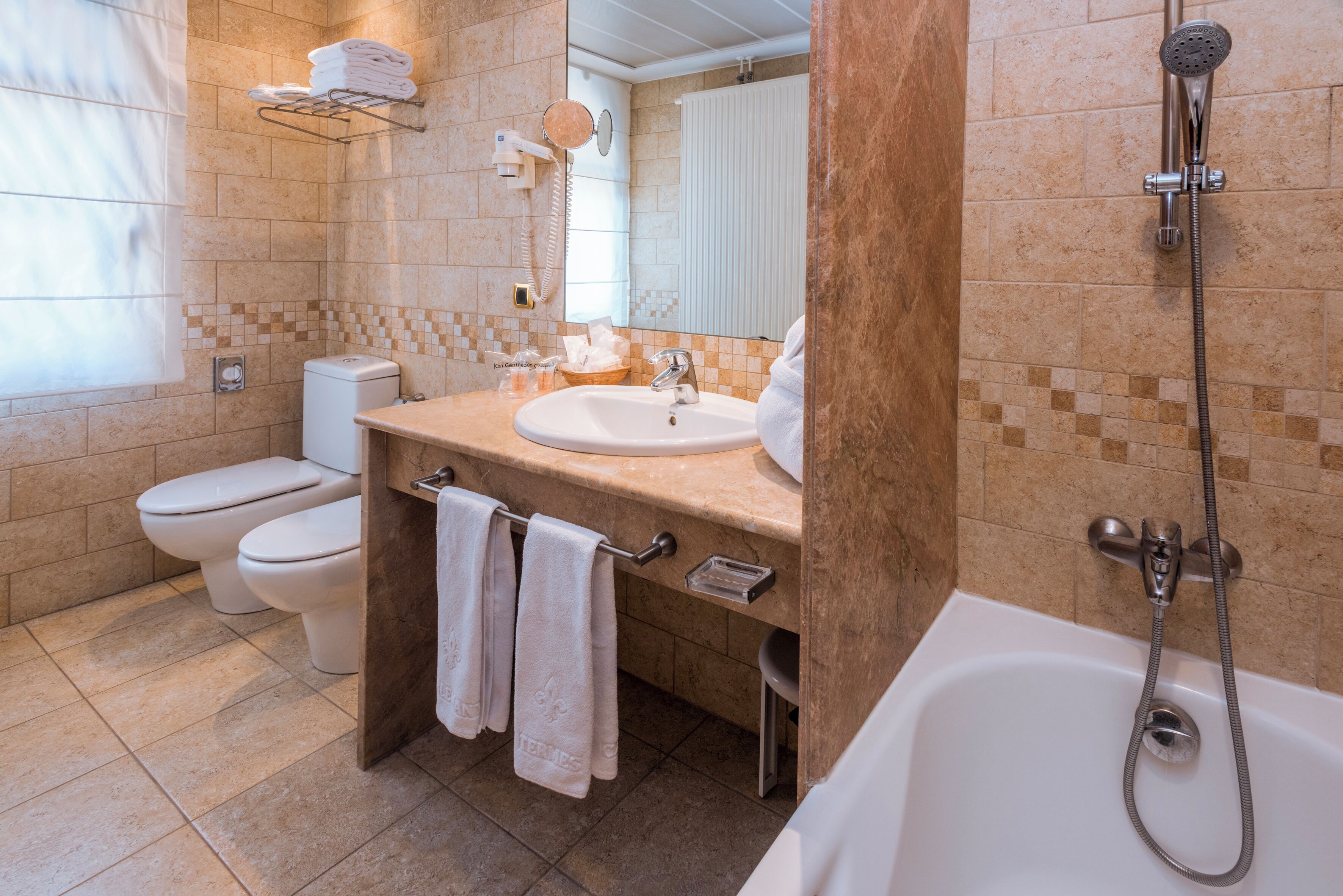 twin room | bathroom | deep-soaking bathtub, free toiletries, hair dryer, bathrobes