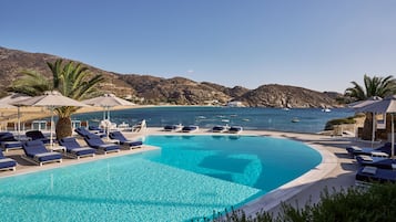 Seasonal outdoor pool, pool umbrellas, pool loungers