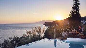 Seasonal outdoor pool, pool umbrellas, pool loungers