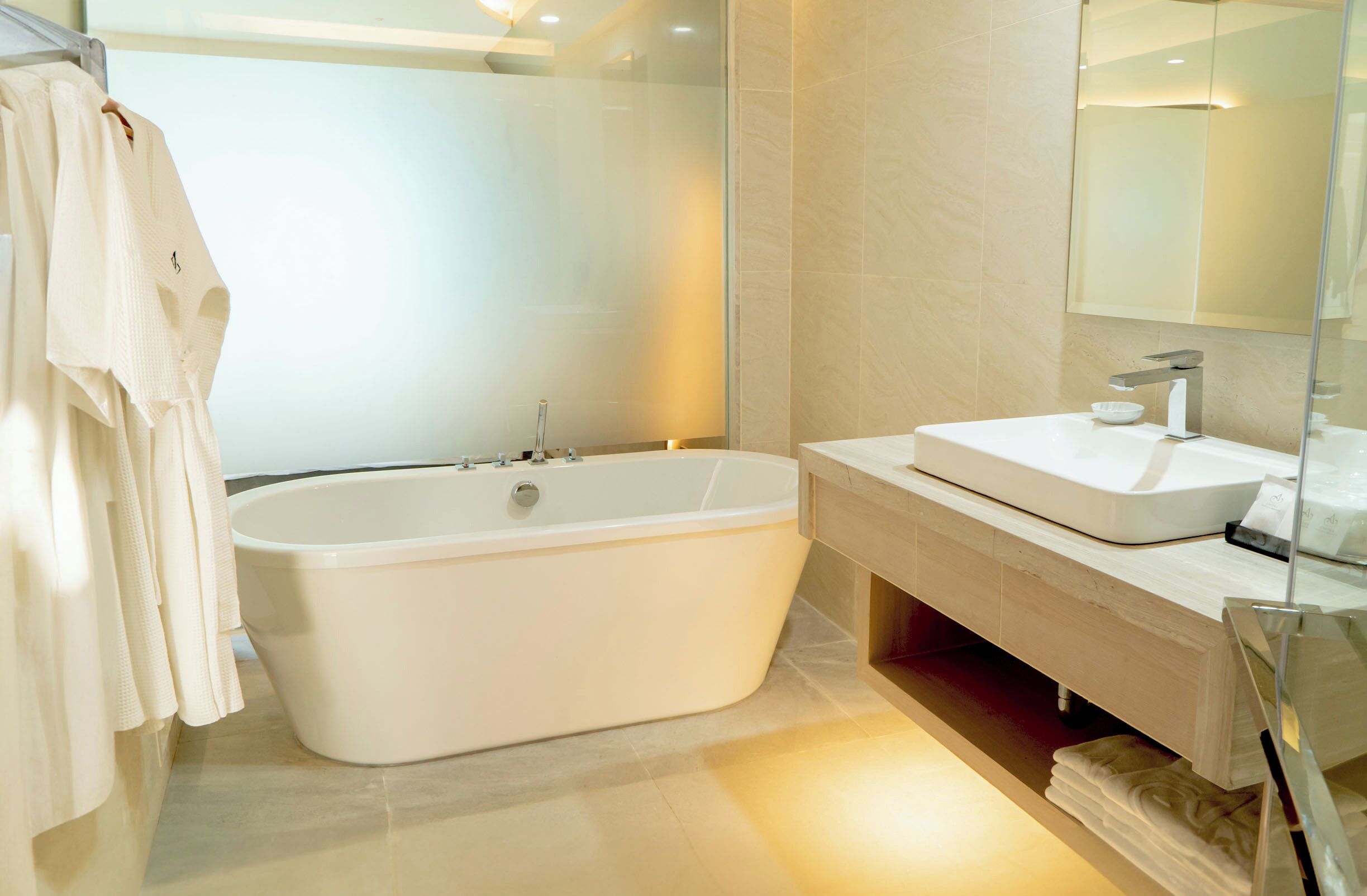 Separate tub and shower, free toiletries, hair dryer, bathrobes