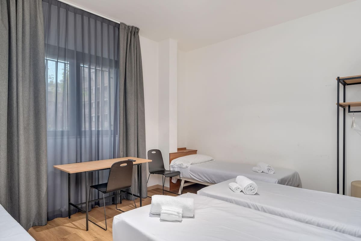 Economy Quadruple Room, Non Smoking | Down comforters, in-room safe, free WiFi, bed sheets