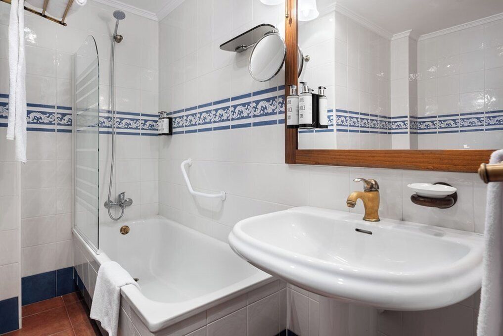 bathtub, eco-friendly toiletries, hair dryer, bidet