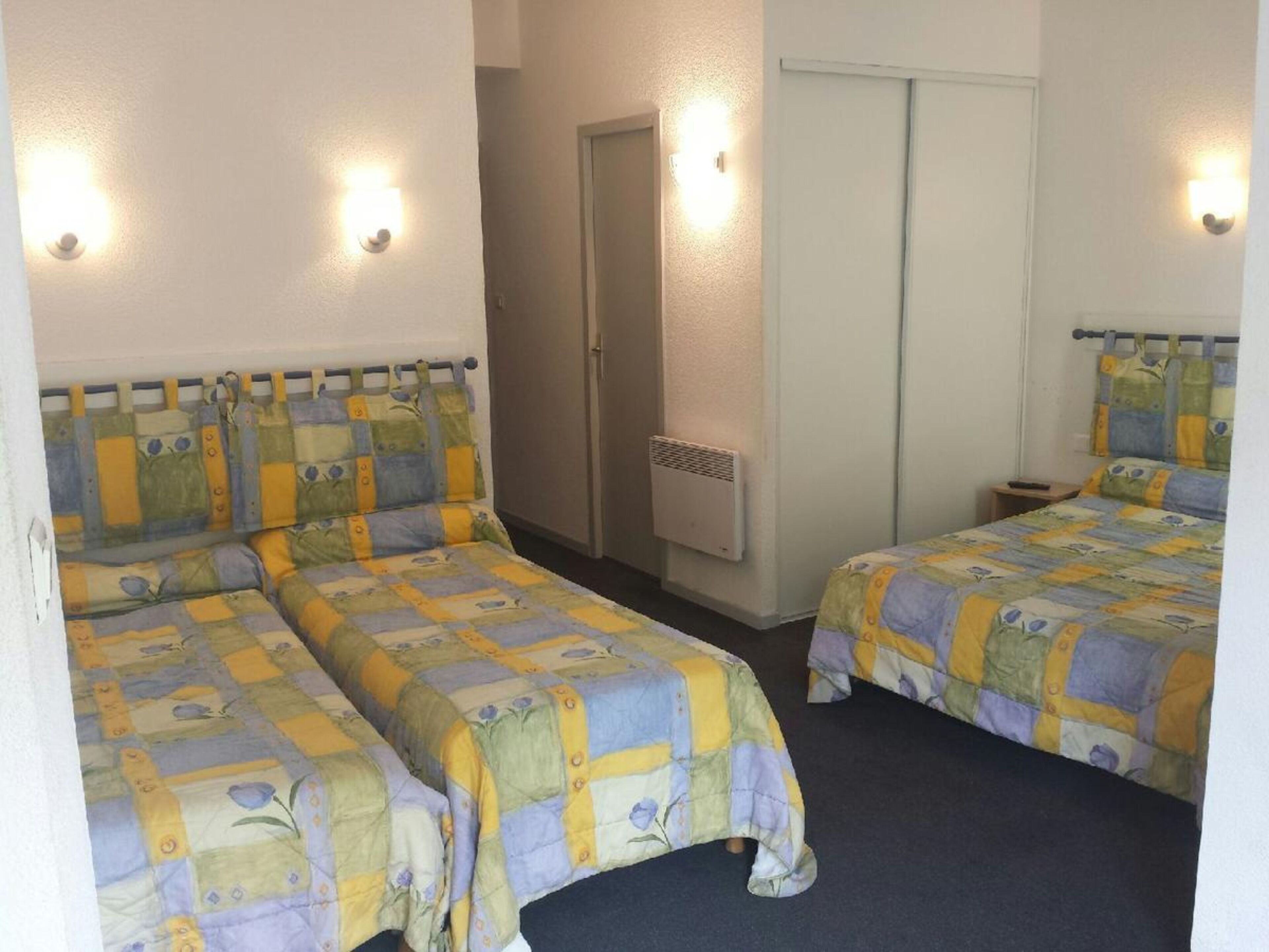 quadruple room | 1 bedroom, premium bedding, desk, blackout curtains