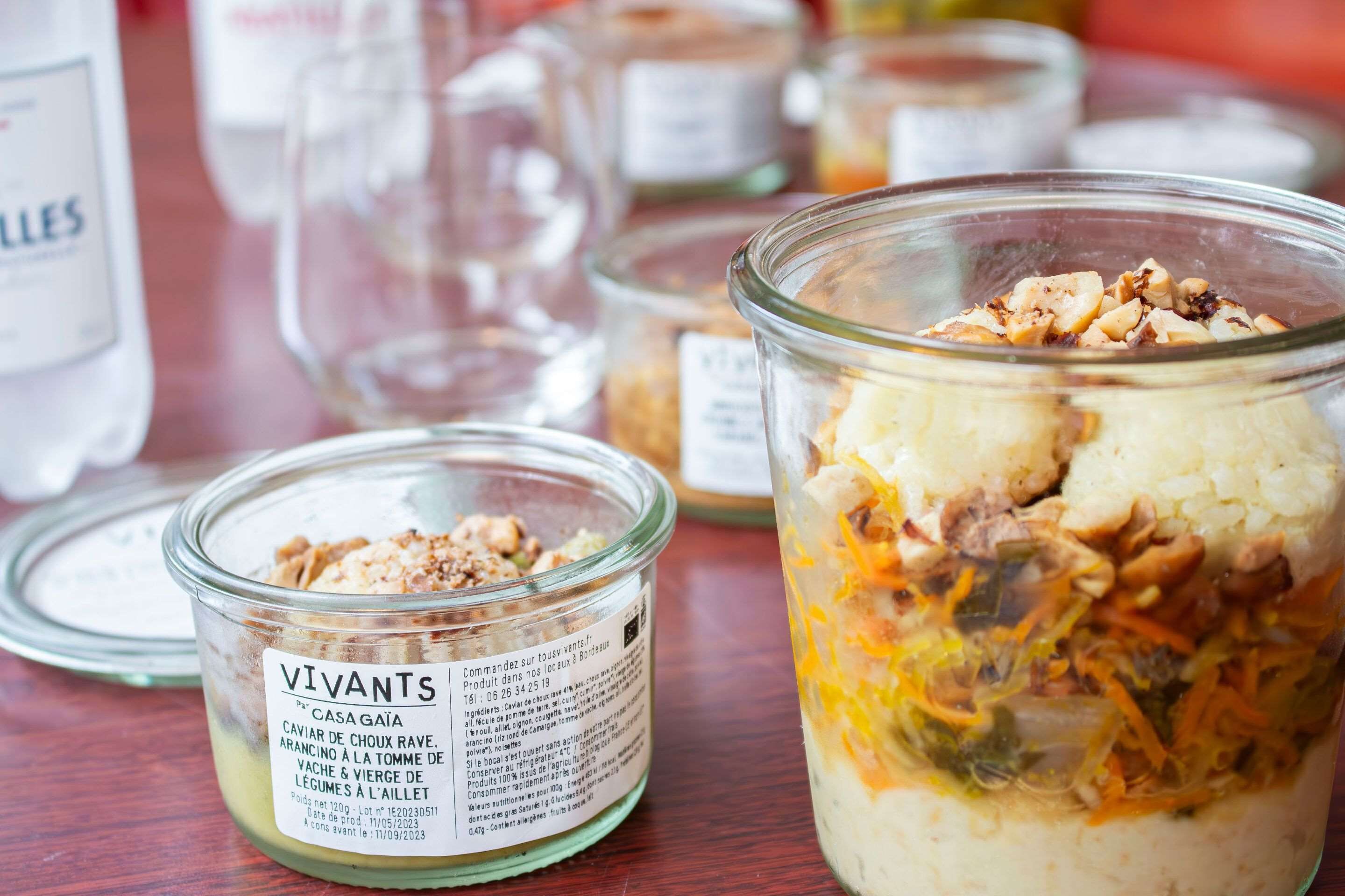 A glass jar with a label and a layered food item.