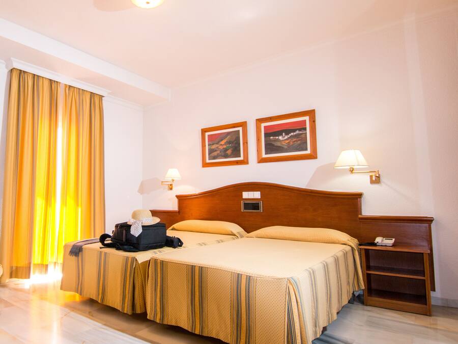 Desk, blackout drapes, WiFi (free), bed sheets