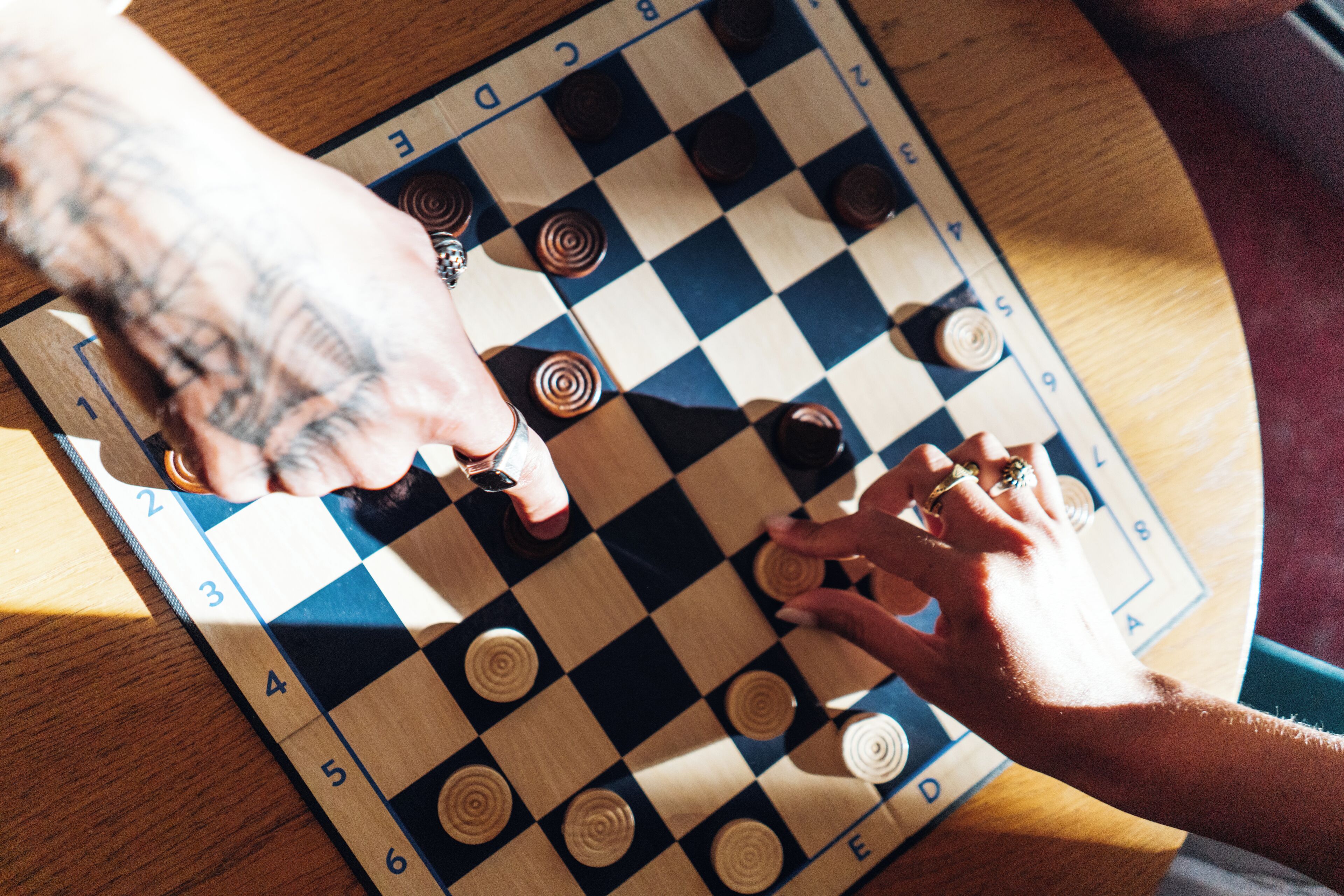 A close-up of a chessboard with a checkered pattern and numbered squares.