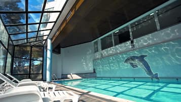 Indoor pool, seasonal outdoor pool, pool umbrellas, pool loungers