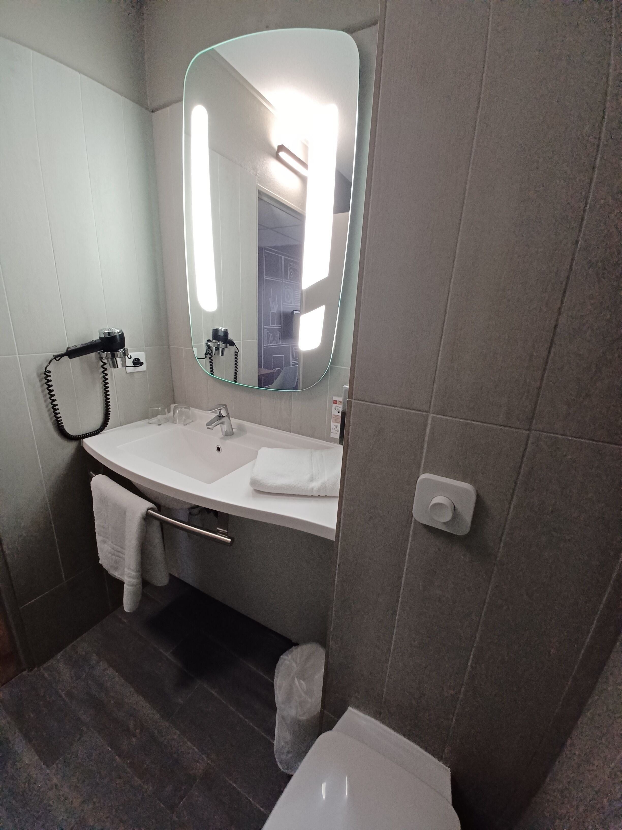 eco-friendly toiletries, hair dryer, towels