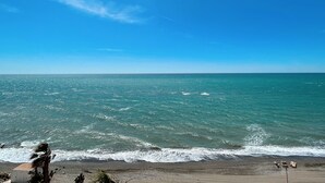 A beach with clear blue water and a sandy shore. - Fay Victoria Beach (Rincon de la Victoria)