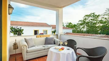 Charming Room with Terrace | Minibar, in-room safe, blackout drapes, iron/ironing board