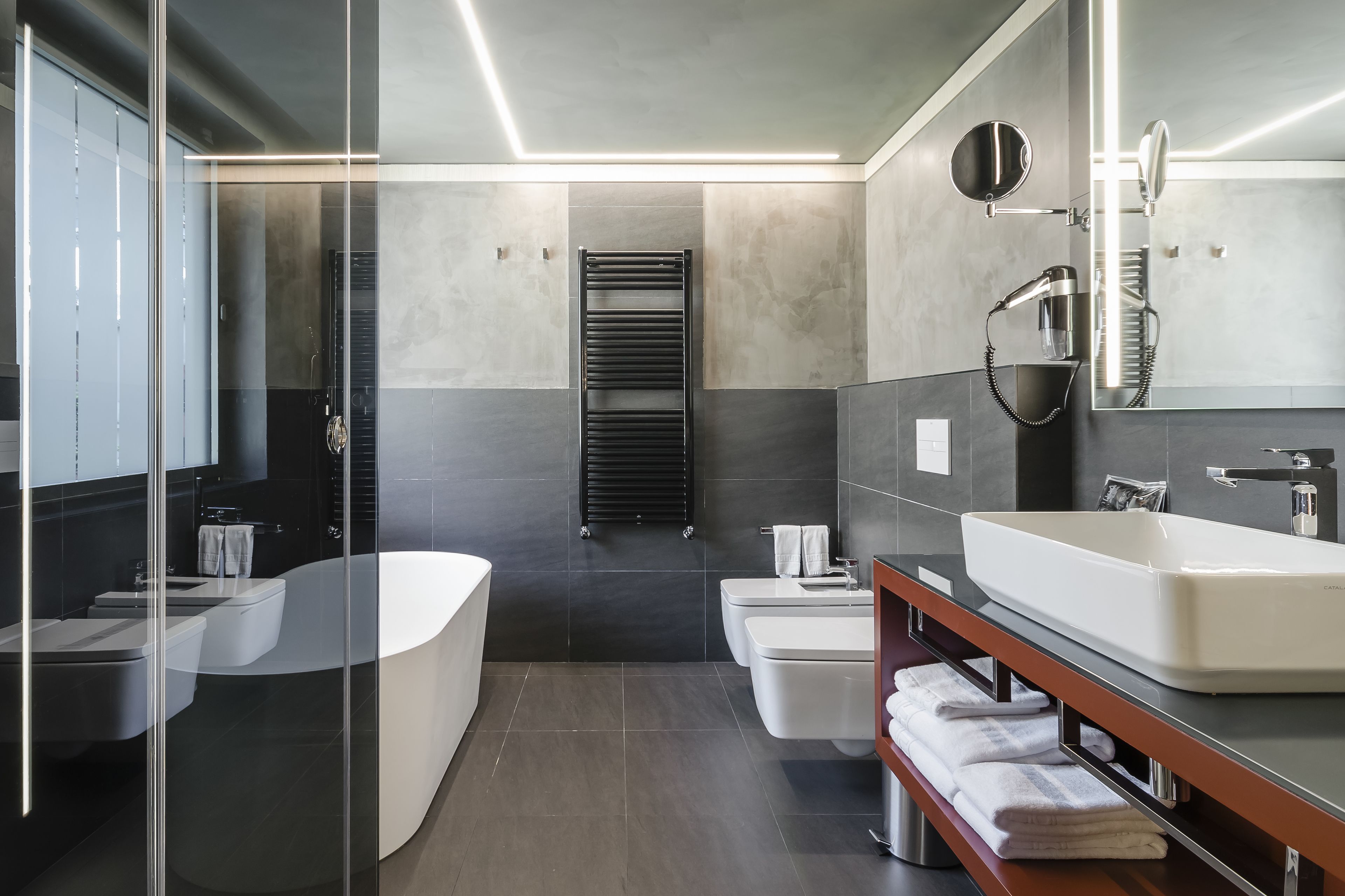 premium room, 1 king bed | bathroom | free toiletries, hair dryer, slippers, towels