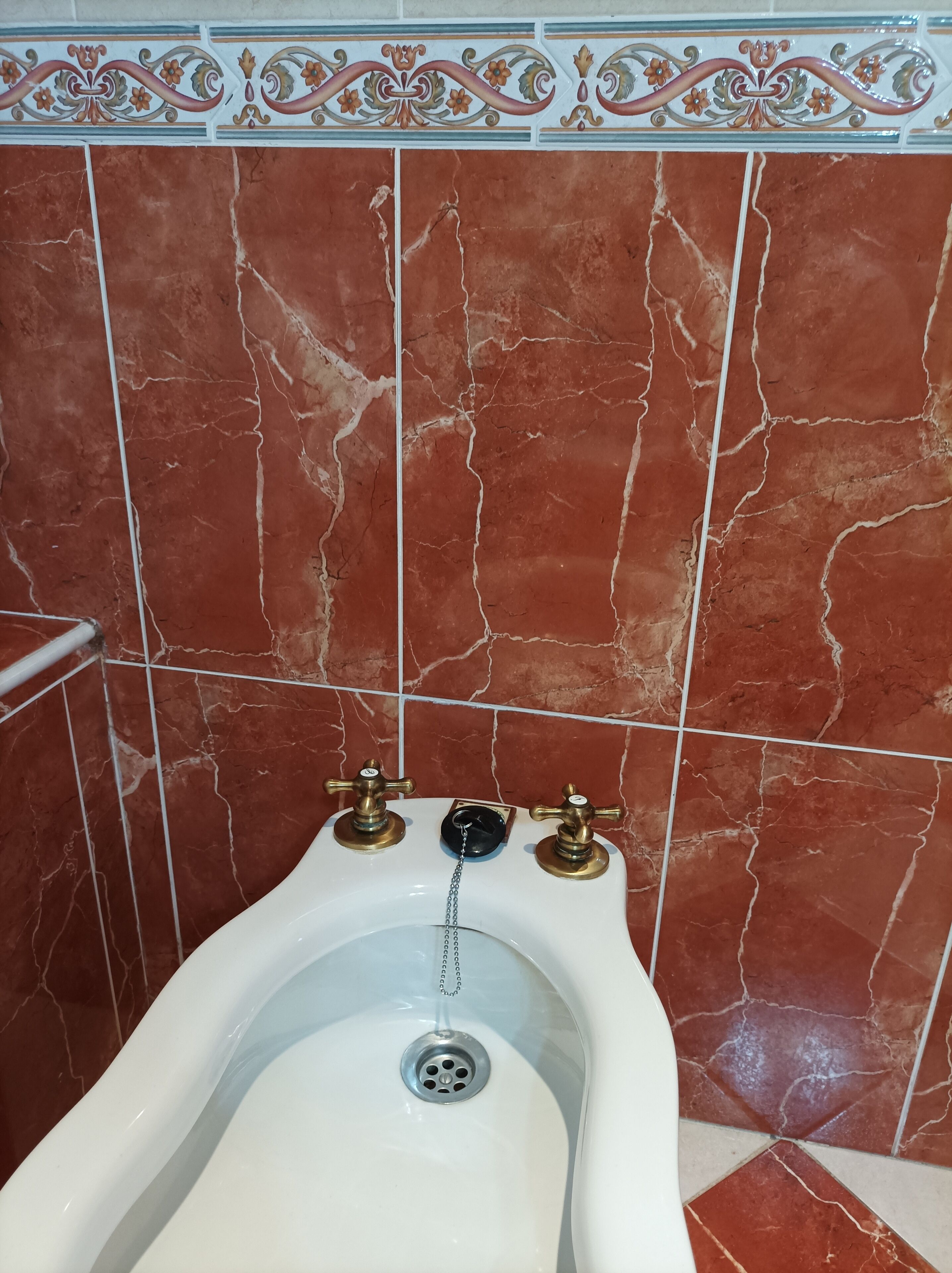 bathtub, bidet, towels, soap