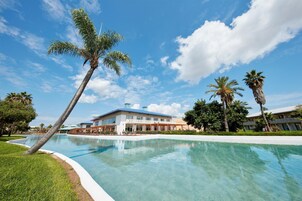 Indoor pool, seasonal outdoor pool, pool umbrellas, sun loungers