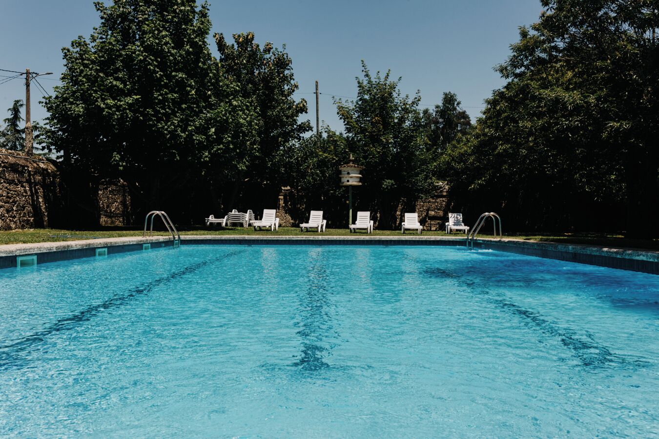Seasonal outdoor pool, pool loungers