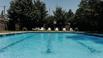 Seasonal outdoor pool, pool loungers