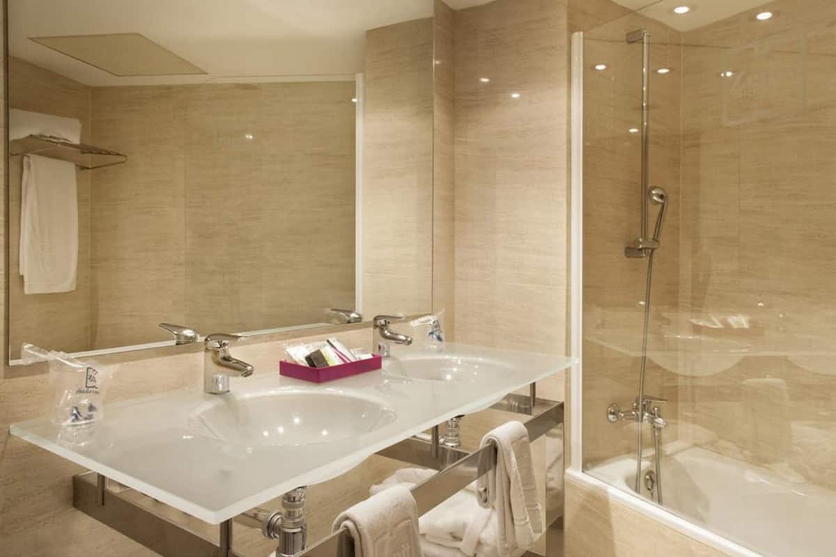 bathtub, eco-friendly toiletries, hair dryer, bidet