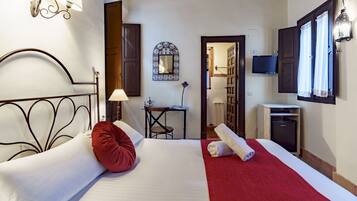 Ropa de cama de alta calidad, cubrecamas y minibar