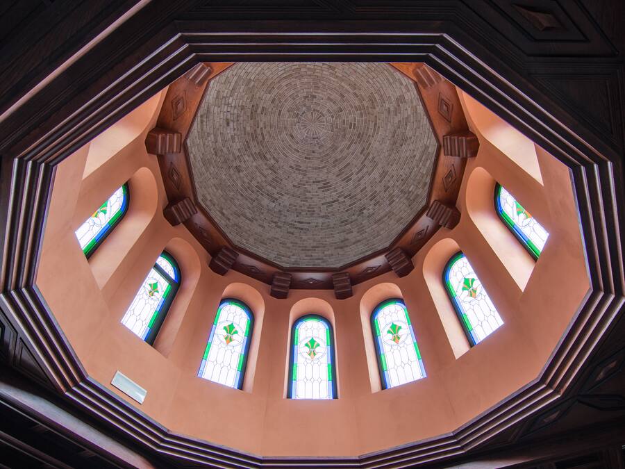 A circular interior with octagonal windows and a central dome.