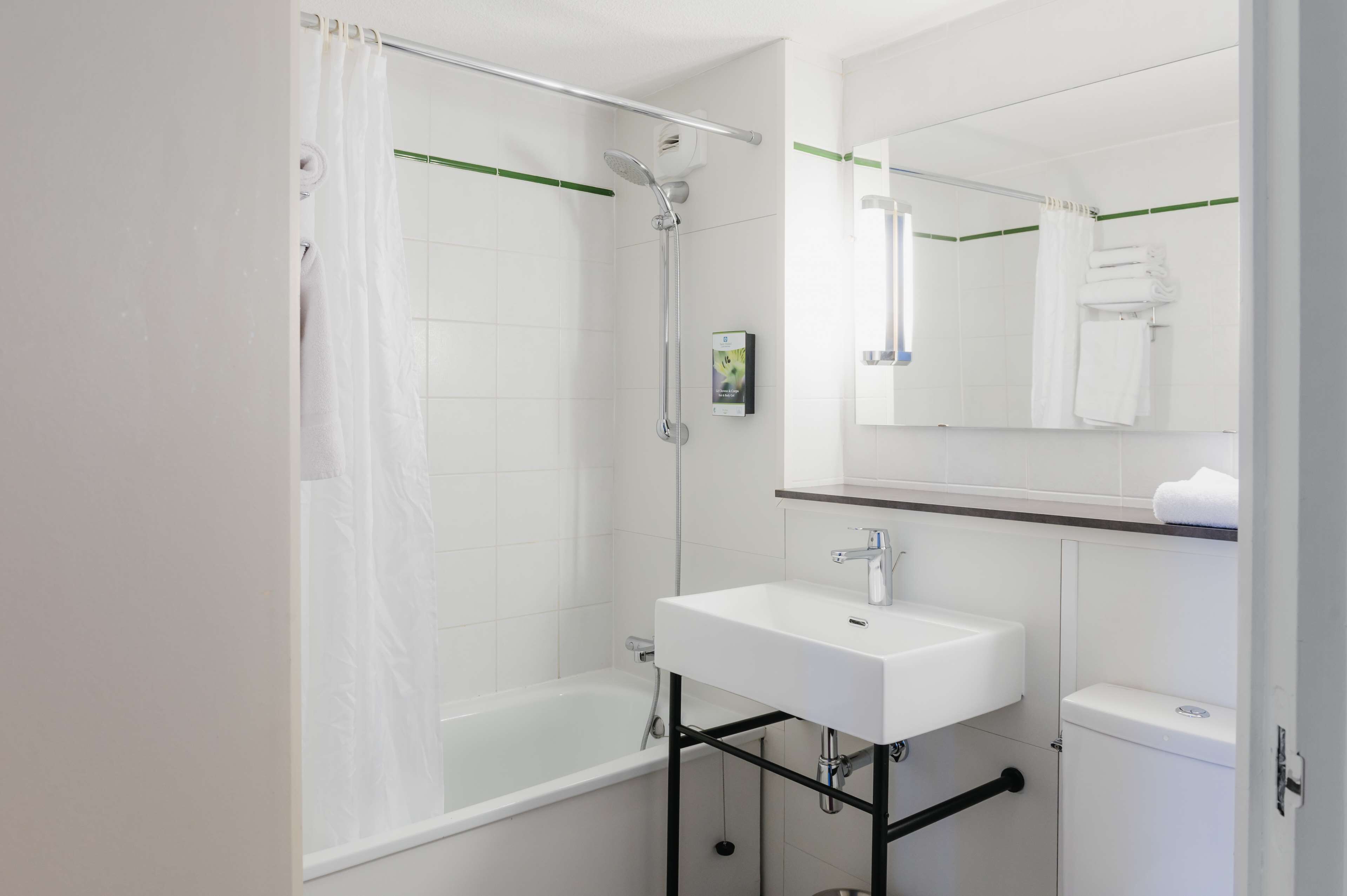 bathtub, free toiletries, hair dryer, towels