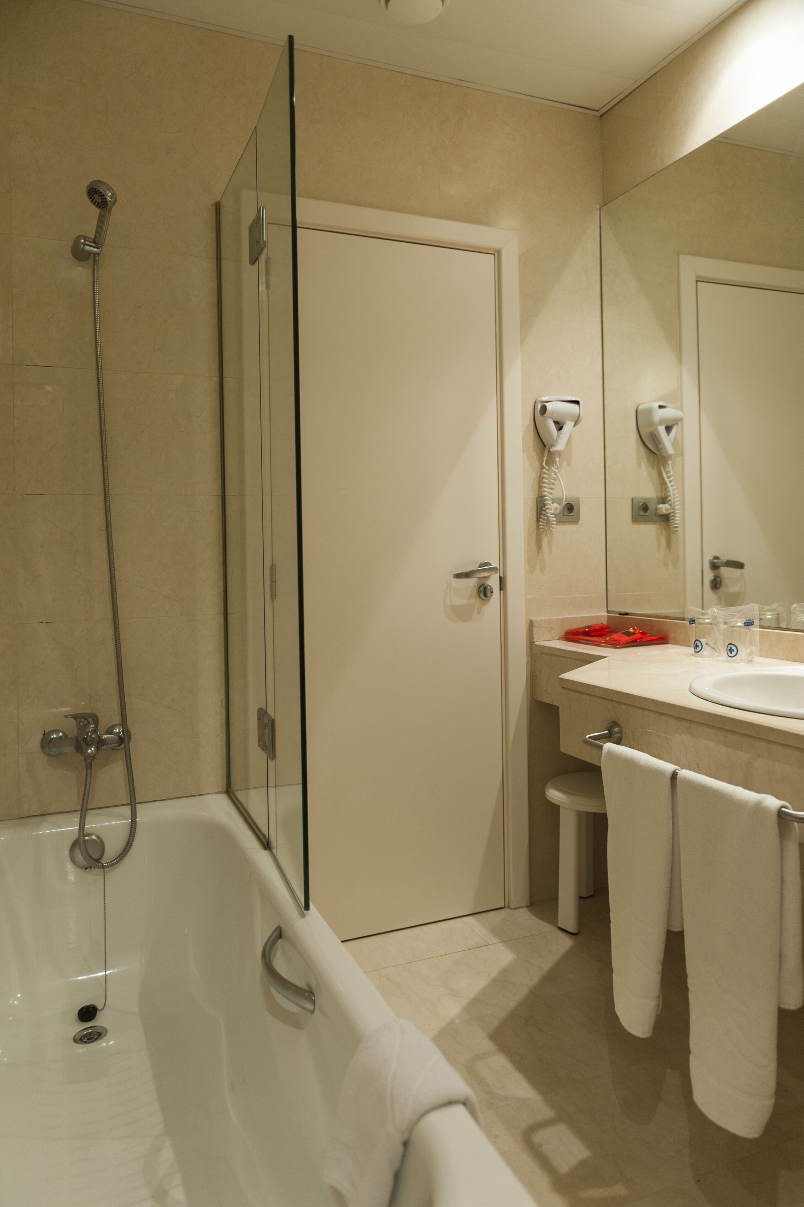 shower, hair dryer, bidet, towels