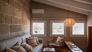 Suite Junior | Coin séjour | Télévision à écran plat