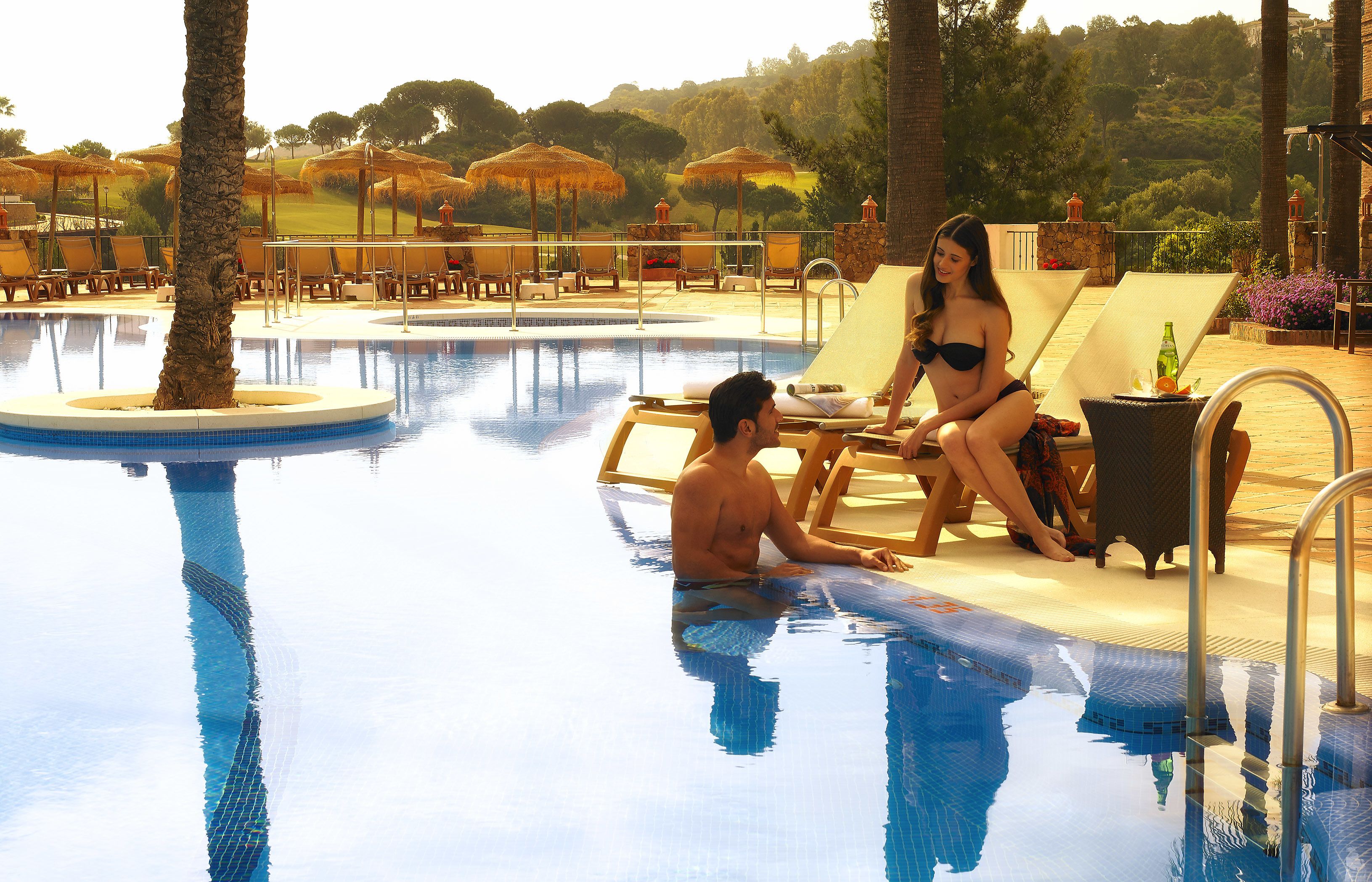indoor pool, outdoor pool, pool umbrellas, pool loungers