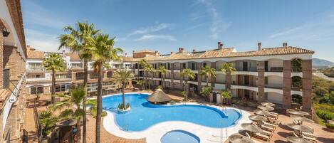 Indoor pool, outdoor pool, pool umbrellas, pool loungers